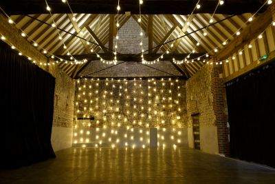 Festoon Light Backdrop at the Monks Barn