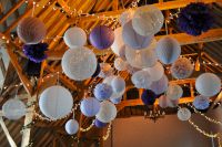 Lanterns with pom poms and honeycomb balls